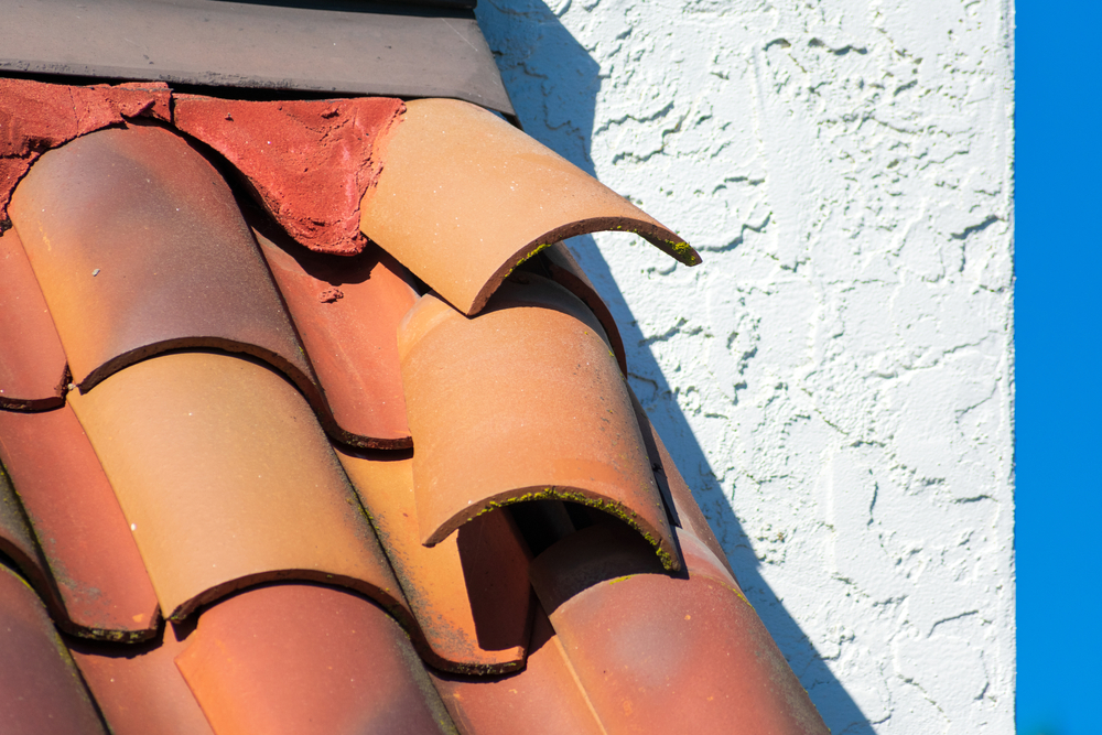 Roof,tiles,dislodged,by,strong,winds,during,storm,require,repair